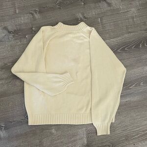 Knitted cream colored cotton sweater